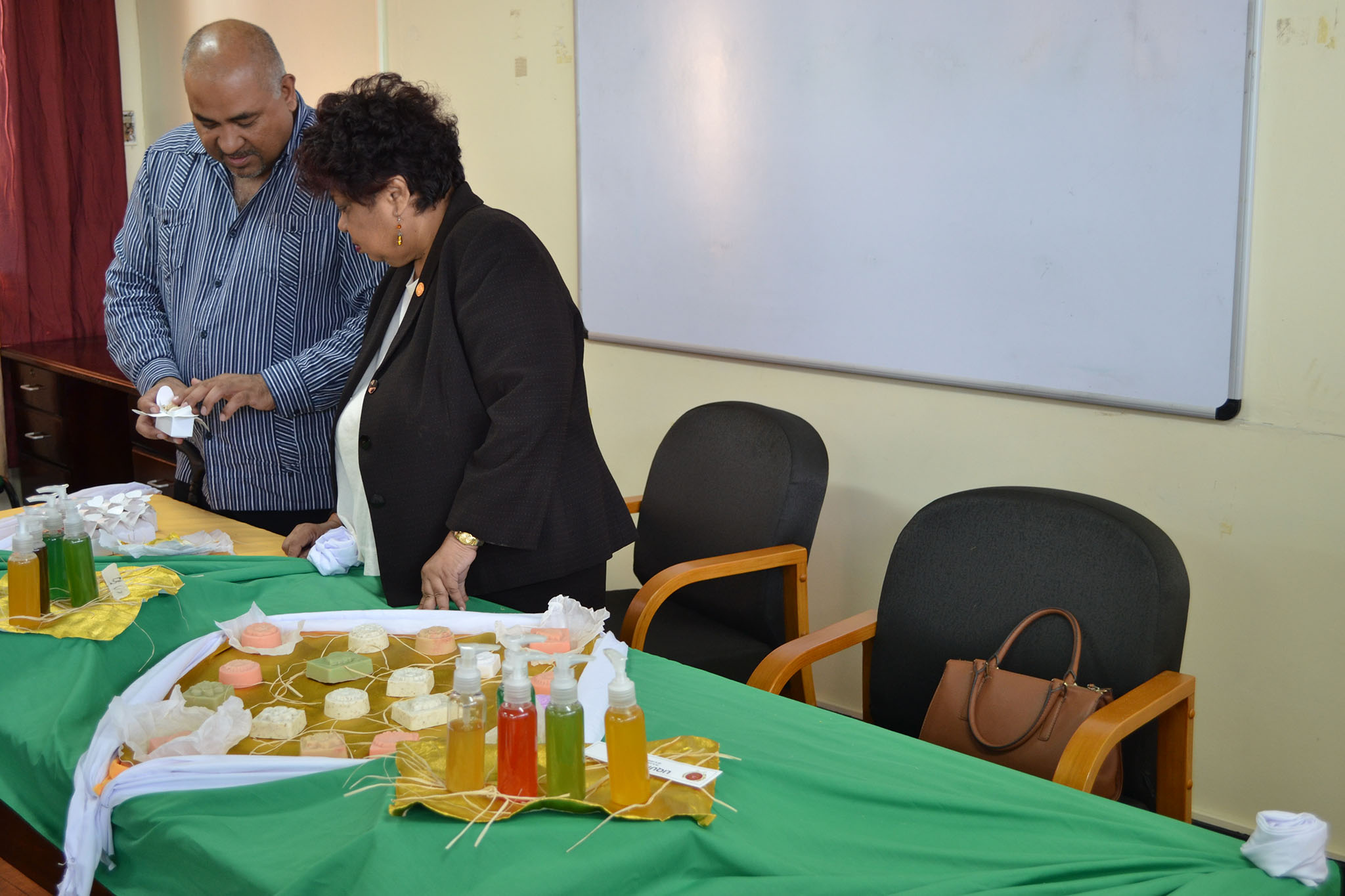Minister Amna Ally meets with Dr Narine in December 2015 to see the early stages of Rupununi essence
